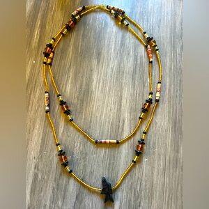 Beaded fetish fish necklace in warm tones | 41” total length